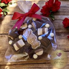 A luxurious Heart-Shaped Chocolate Bar, topped with a Kinder Happy Hippo,Kinder Bueno, Ferrero Rocher and White and Milk Belgian Chocolate buttons.